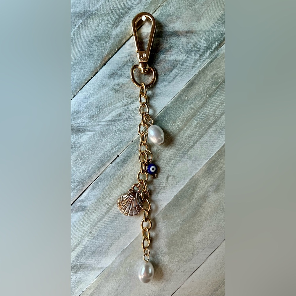Gold bag charm with Shell and Pearl Charms